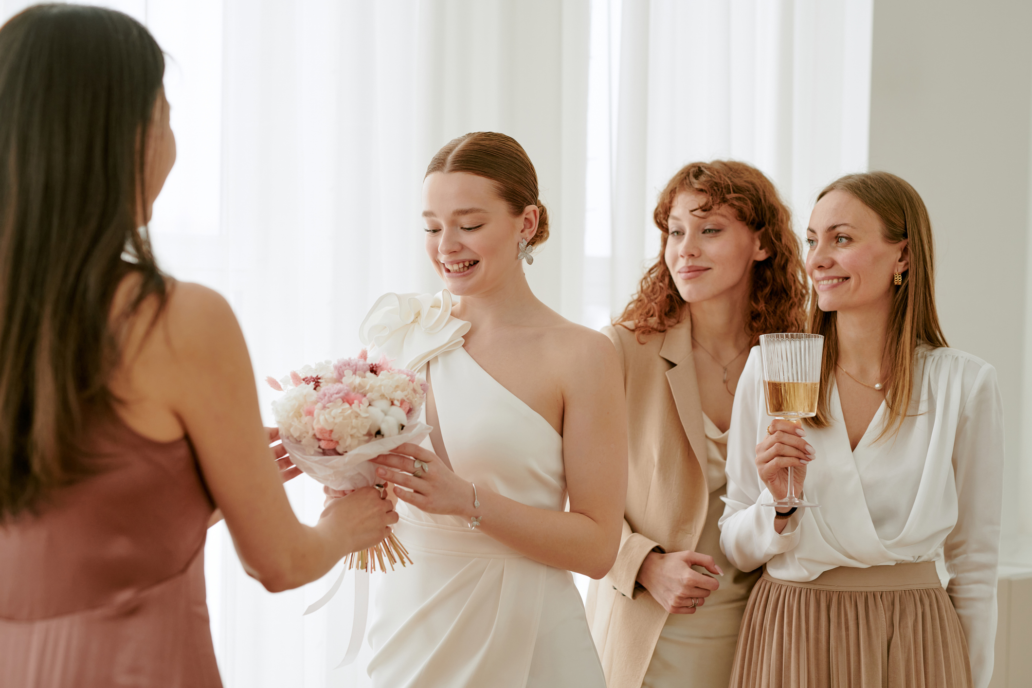 Bride getting ready with fragrance for wedding day